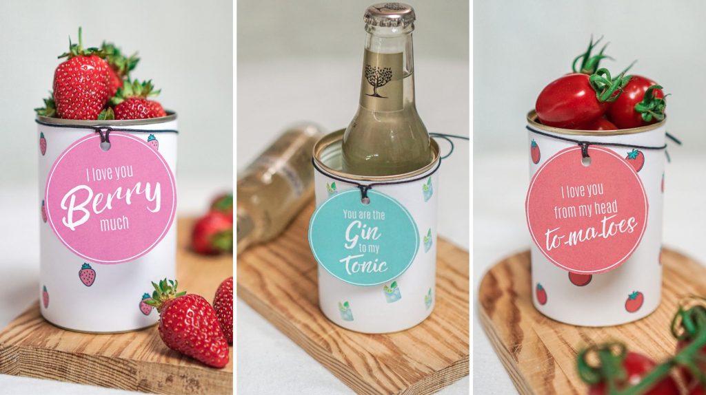 Drei verschiedene Dosen Geschenk Varianten, darunter Erdbeeren-, Gin Tonic- und Tomaten-Motiv, als kreatives Konservendosen Upcycling.